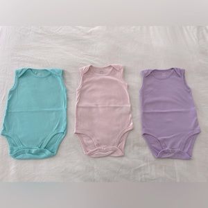 3 pack of pastel onesies in size 24 months - by Amazon basics! Like new!